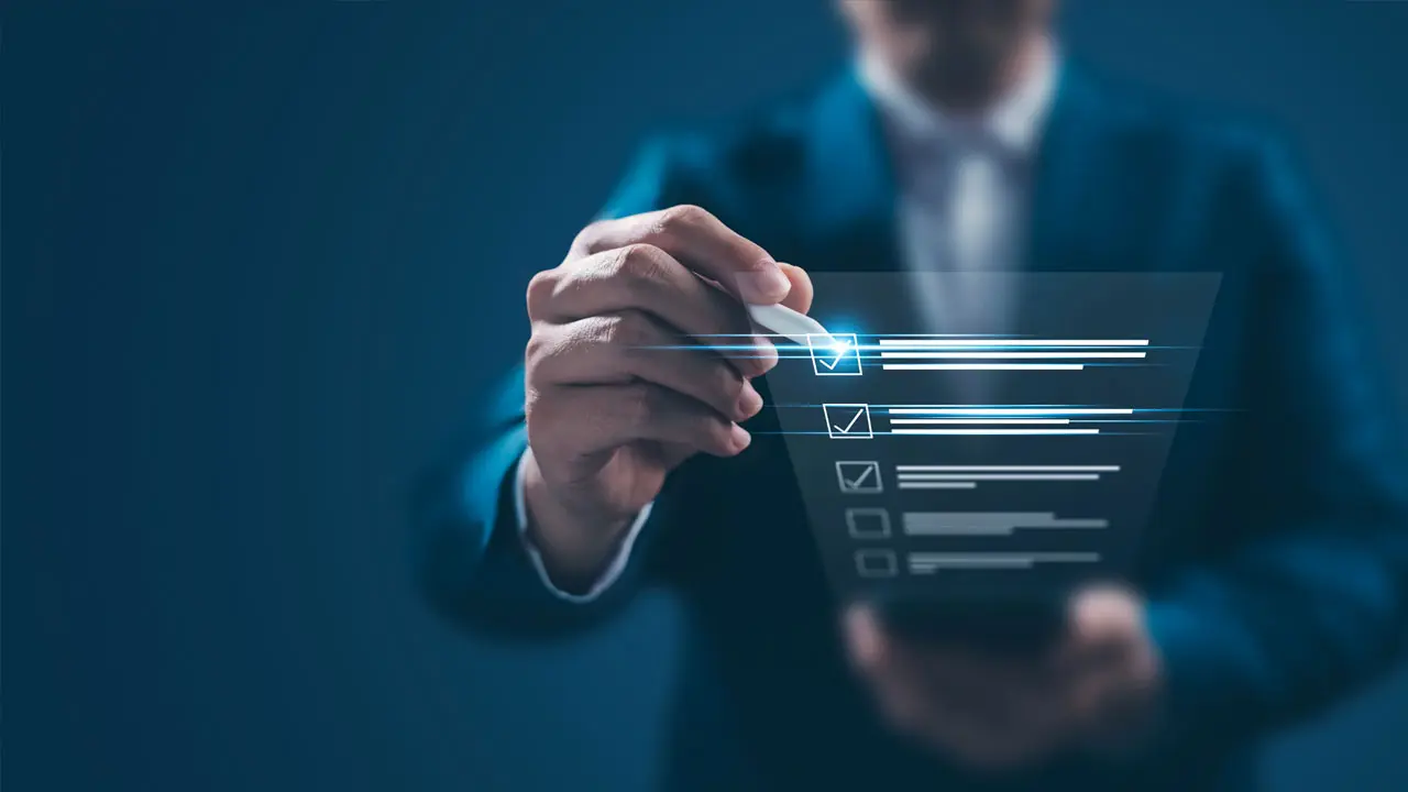 A person wearing a suit interacts with a transparent digital screen, ticking options on a virtual checklist. The picture illustrates the completion of a digital quiz or online survey, with sleek graphic elements and a high-tech setting. A person wearing a suit interacts with a transparent digital screen, ticking options on a virtual checklist. The picture illustrates the completion of a digital quiz or online survey, with sleek graphic elements and a high-tech setting.